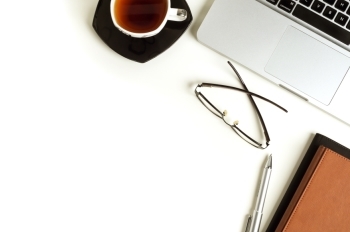 laptop and coffee on table